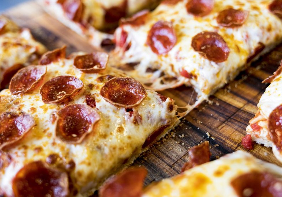 Hot and fresh pepperoni pizzas from Caliente Pizza & Draft House ready for purchase at Acrisure Stadium.