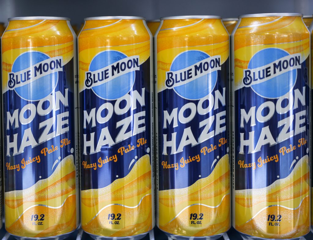 A line of Blue Moon Moon Haze beers in cans at Acrisure Stadium