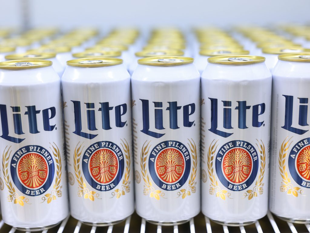 A line of Miller Lite beers in cans at Acrisure Stadium